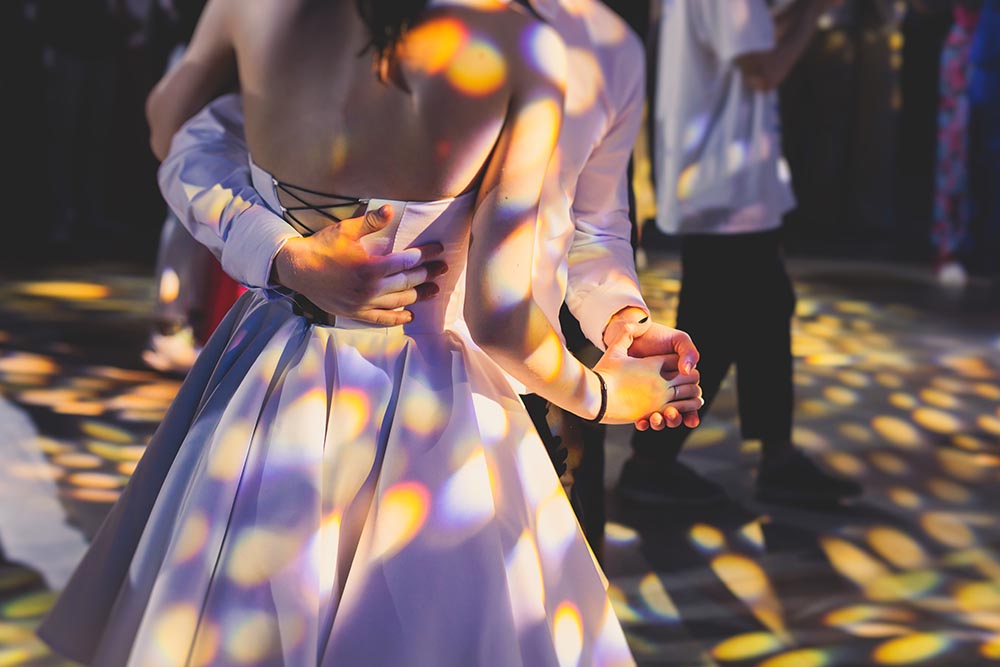 High school prom dancing on a dance floor.