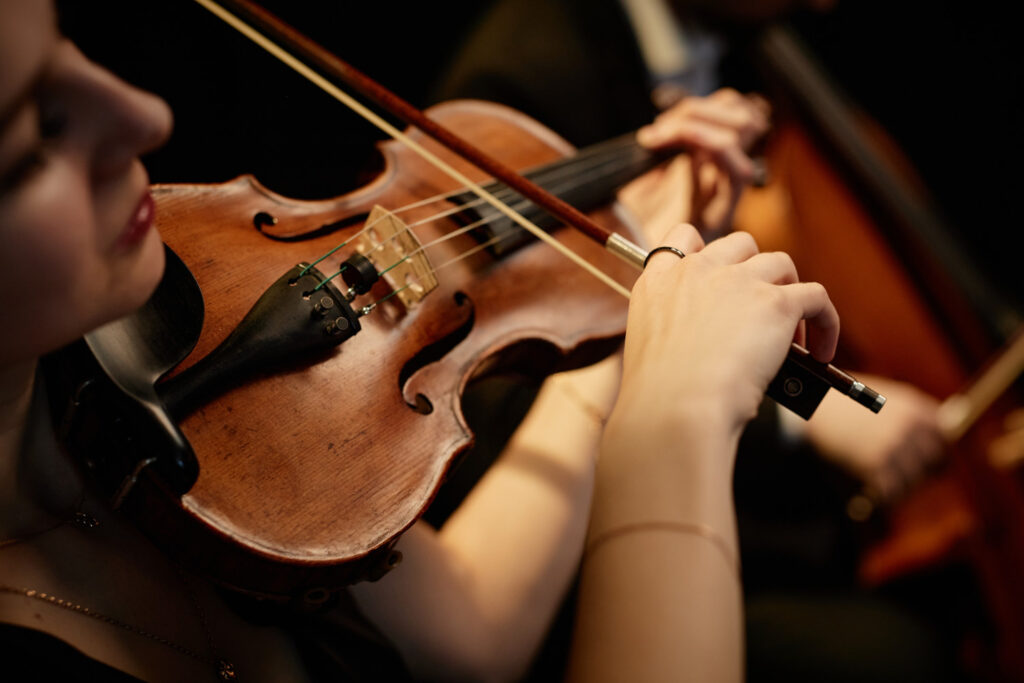 Close up of woman playing the violin